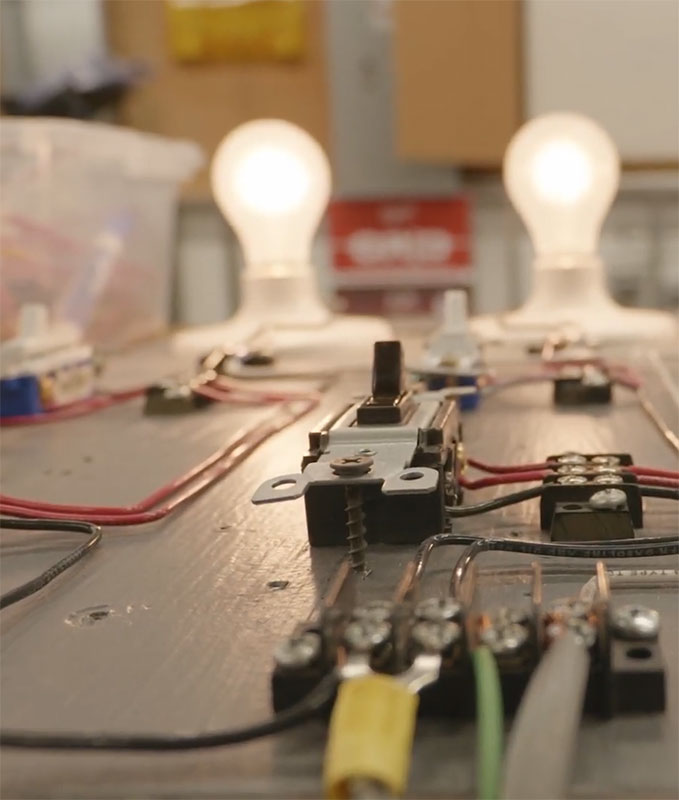 Light bulbs on table showing a electrical system.